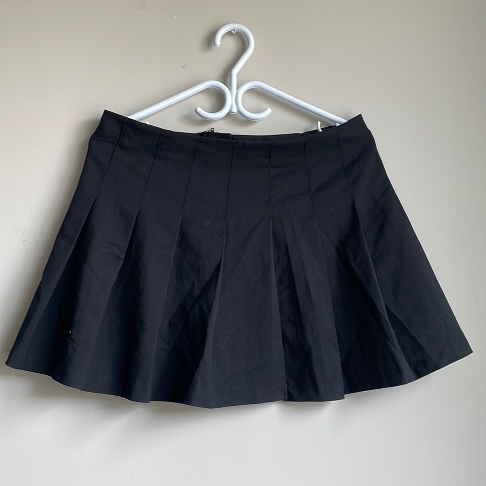 Black mini tennis skirt